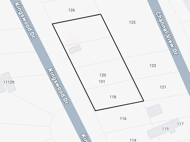 a close up of a air conditioner and a gate