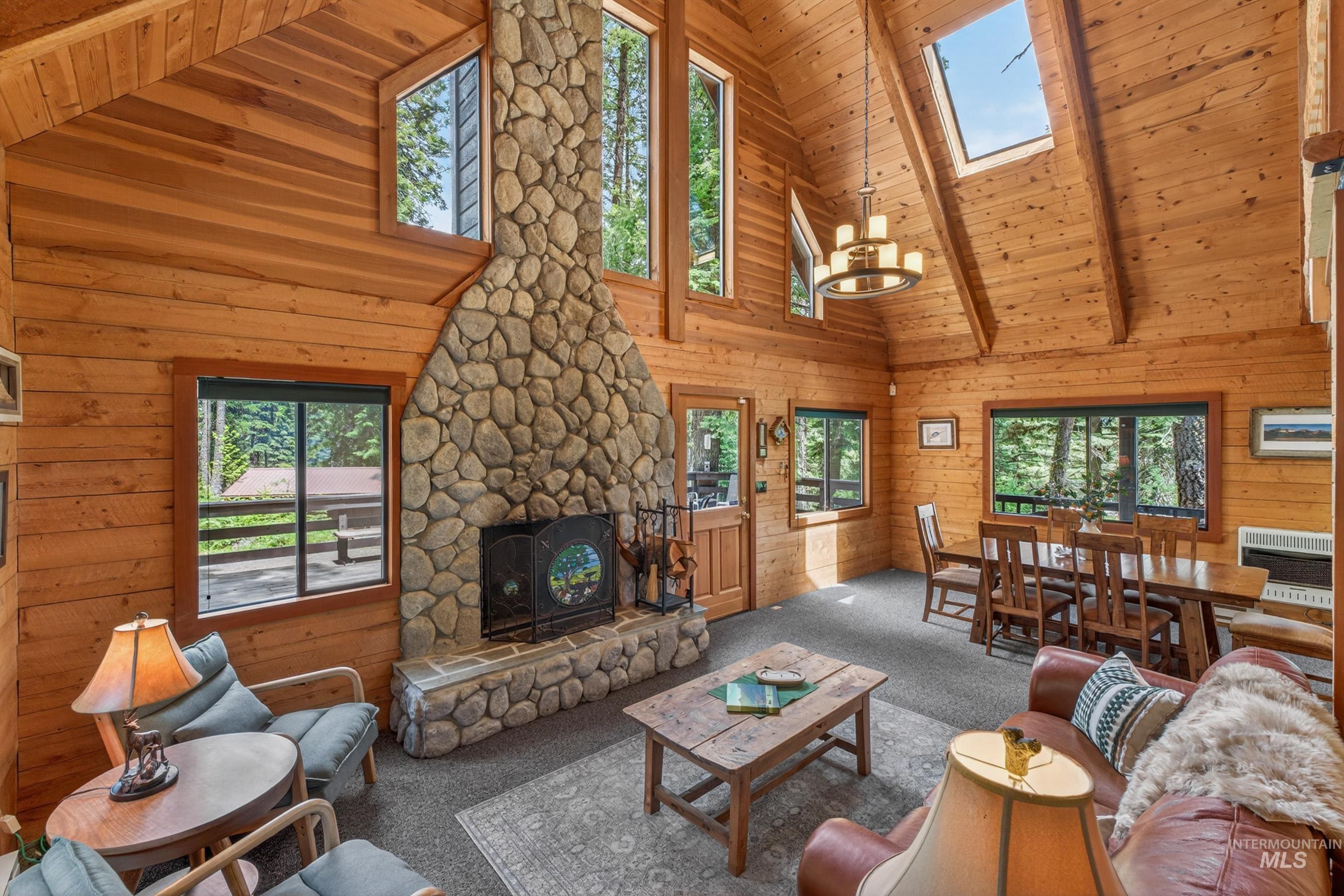 2339 West Mountain Road Donnelly, ID 83615 - Photo 3 of 37 Vaulted ceilings with exposed beams and wood-paneled walls