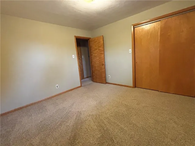 a white toilet sitting next to a bathroom