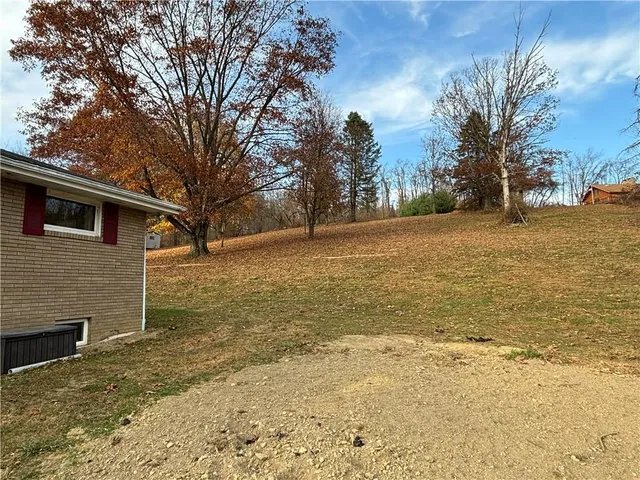 a sign board with yard in front of it