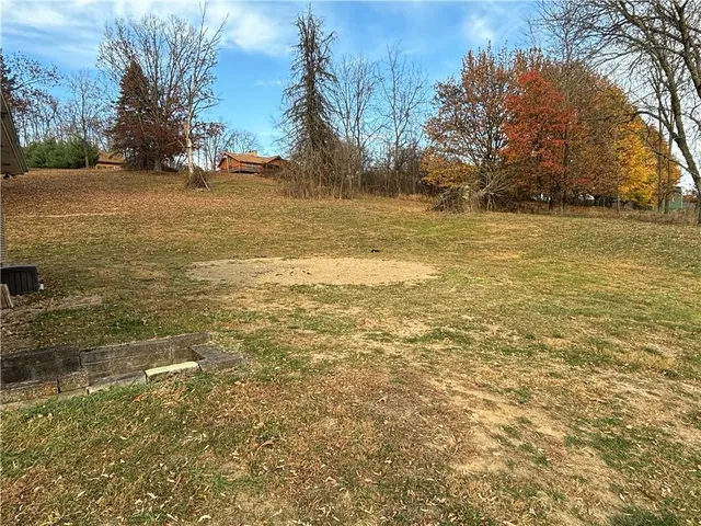 wooden floor in an empty room with a fireplace