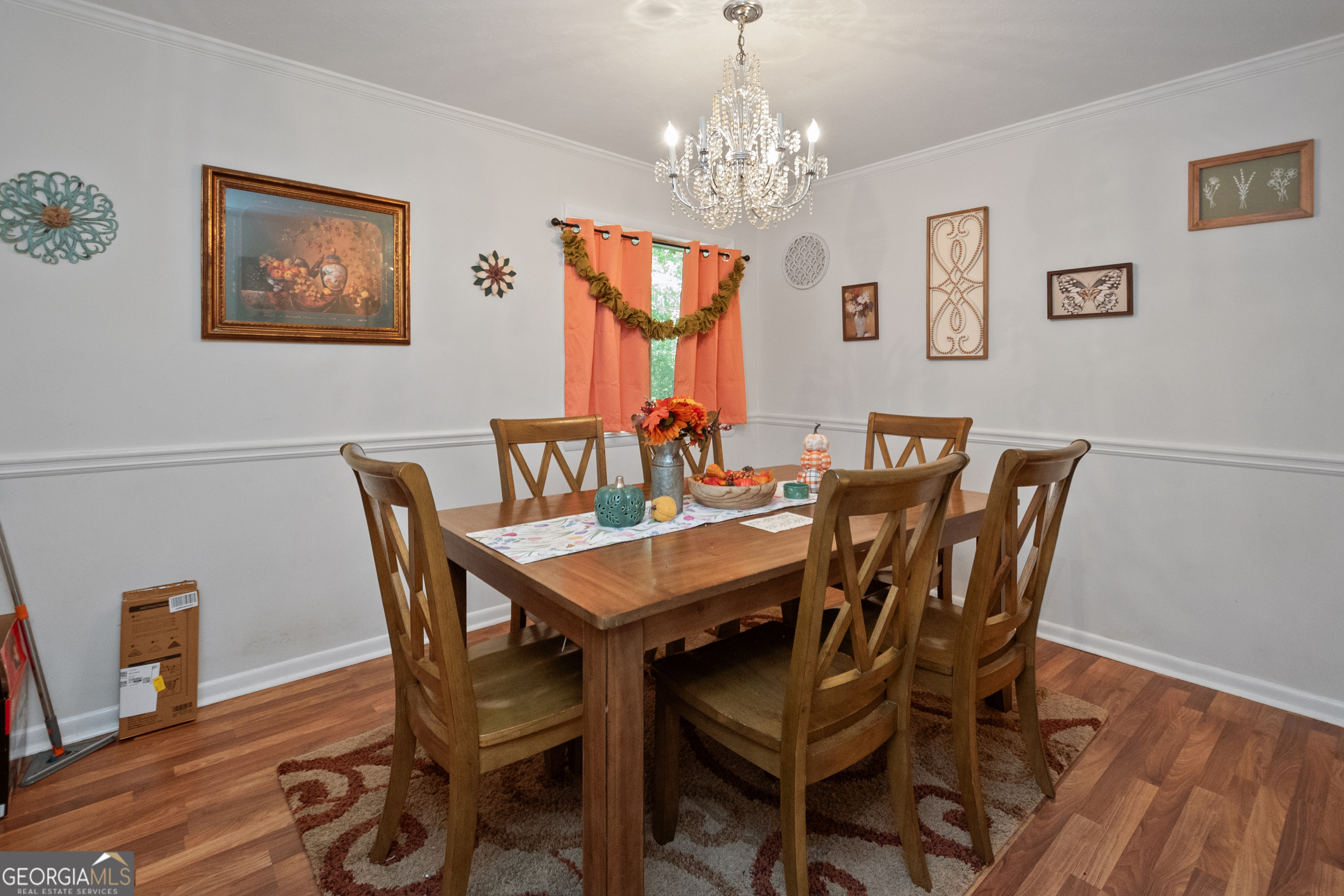 808 South Fling Road LaGrange, GA 30240 - Photo 11 of 35 a view of a dining room with furniture wooden floor and a chandelier