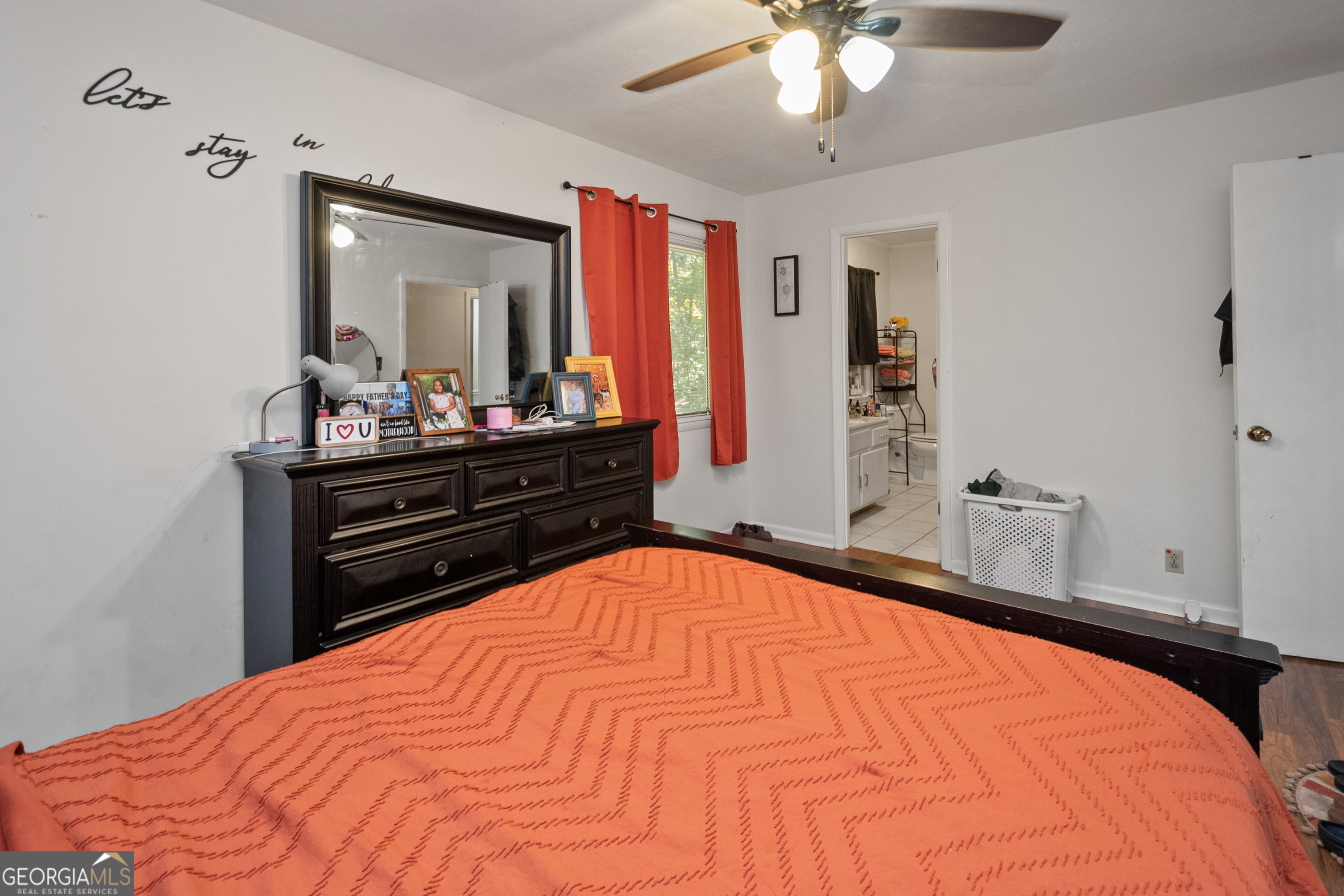 808 South Fling Road LaGrange, GA 30240 - Photo 14 of 35 a bed room with a bed mirror and a desk