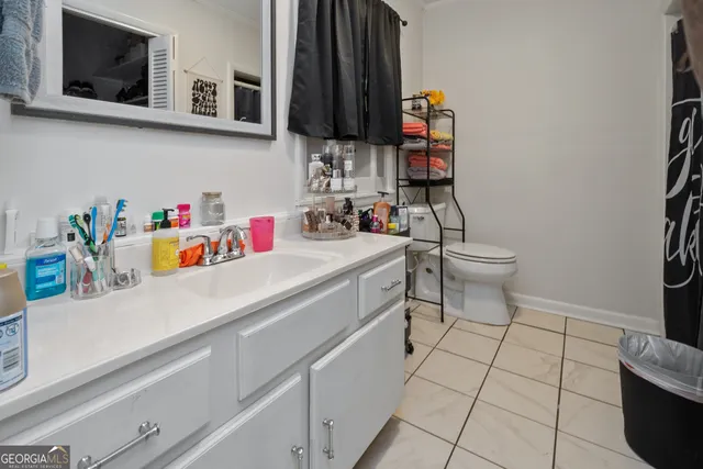 a utility room with sink dryer and washer
