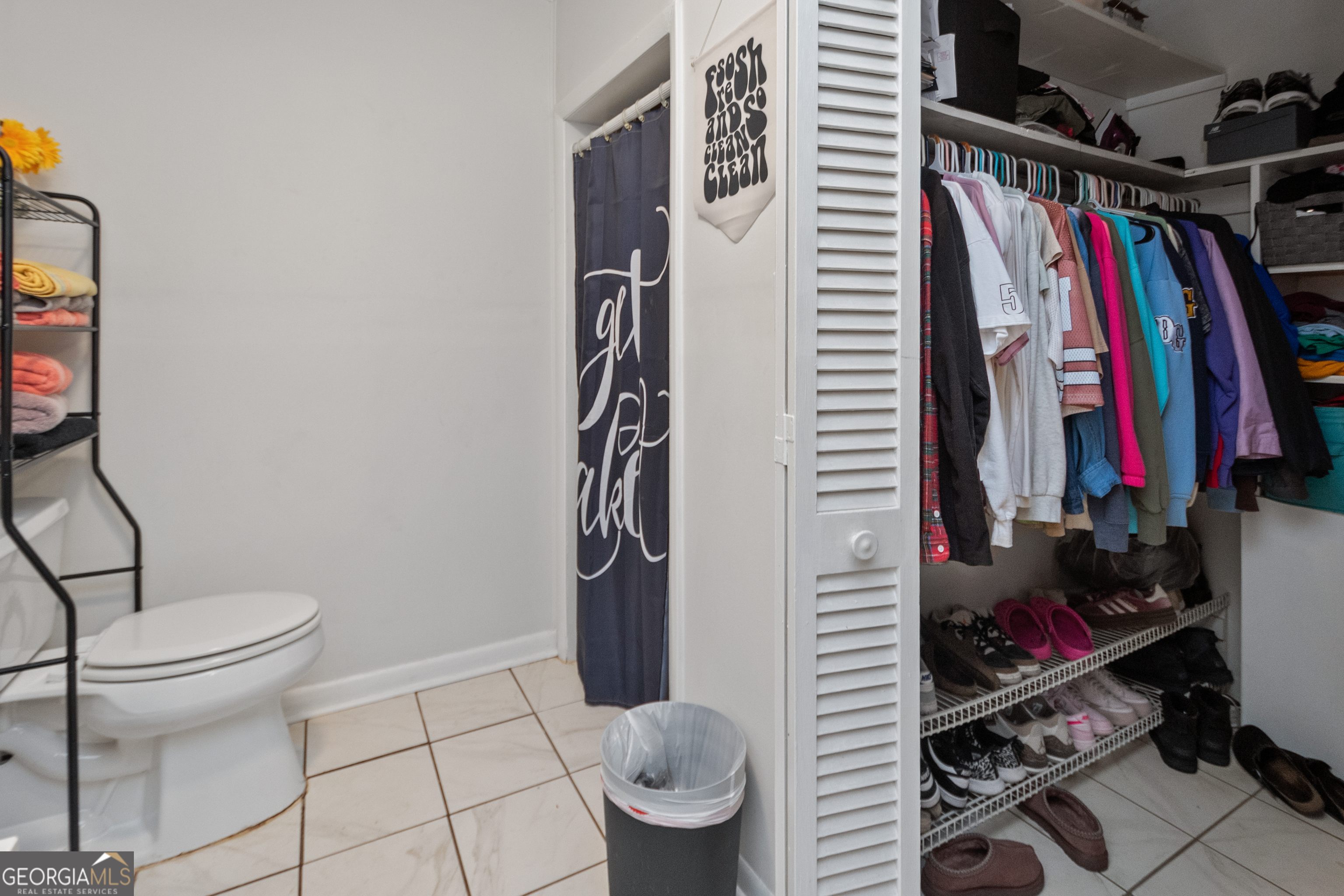 808 South Fling Road LaGrange, GA 30240 - Photo 16 of 35 a view of walk in closet with clothes and shoes