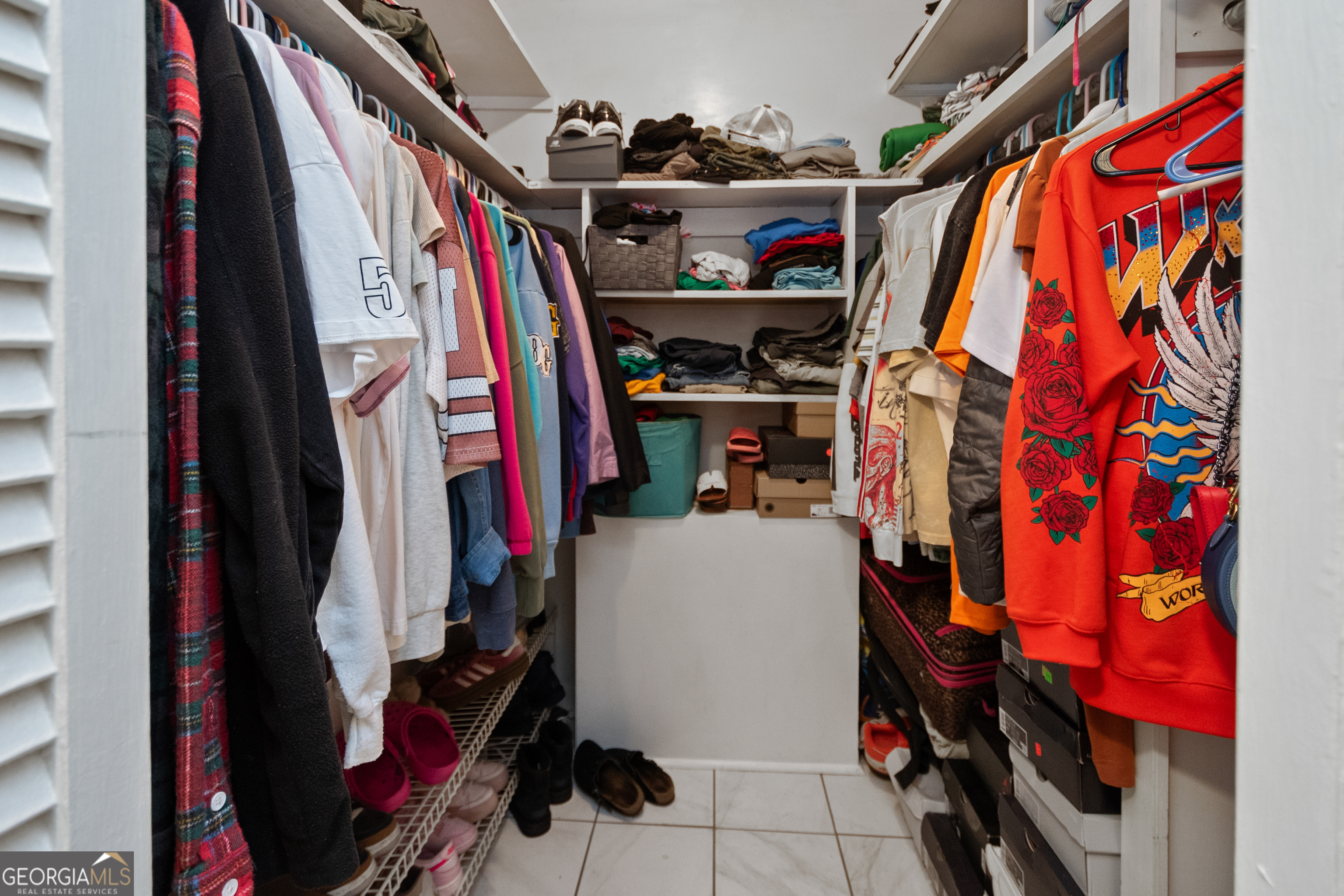 808 South Fling Road LaGrange, GA 30240 - Photo 17 of 35 a view of walk in closet with clothes and shoes
