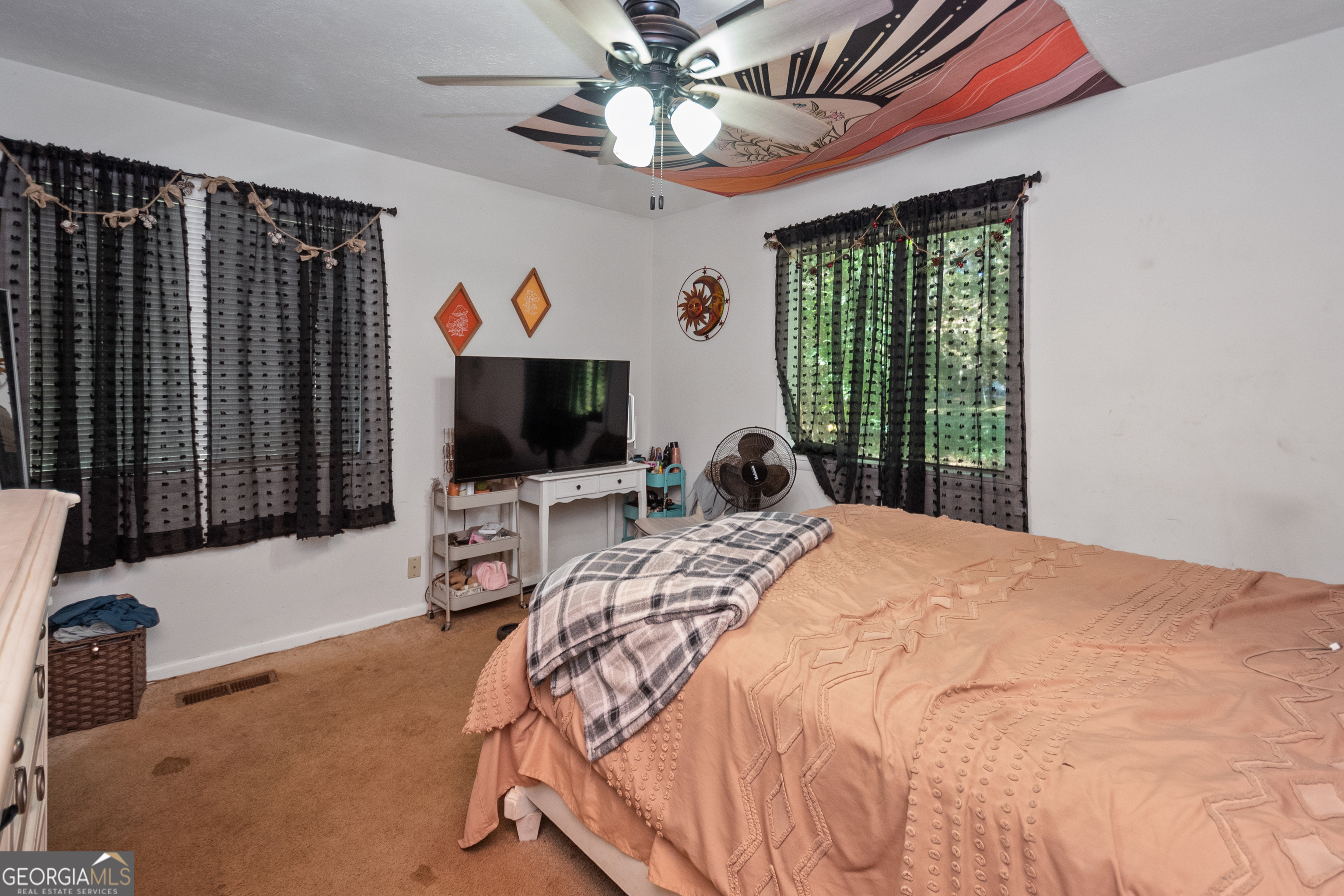 808 South Fling Road LaGrange, GA 30240 - Photo 18 of 35 a bedroom with a bed and a flat screen tv
