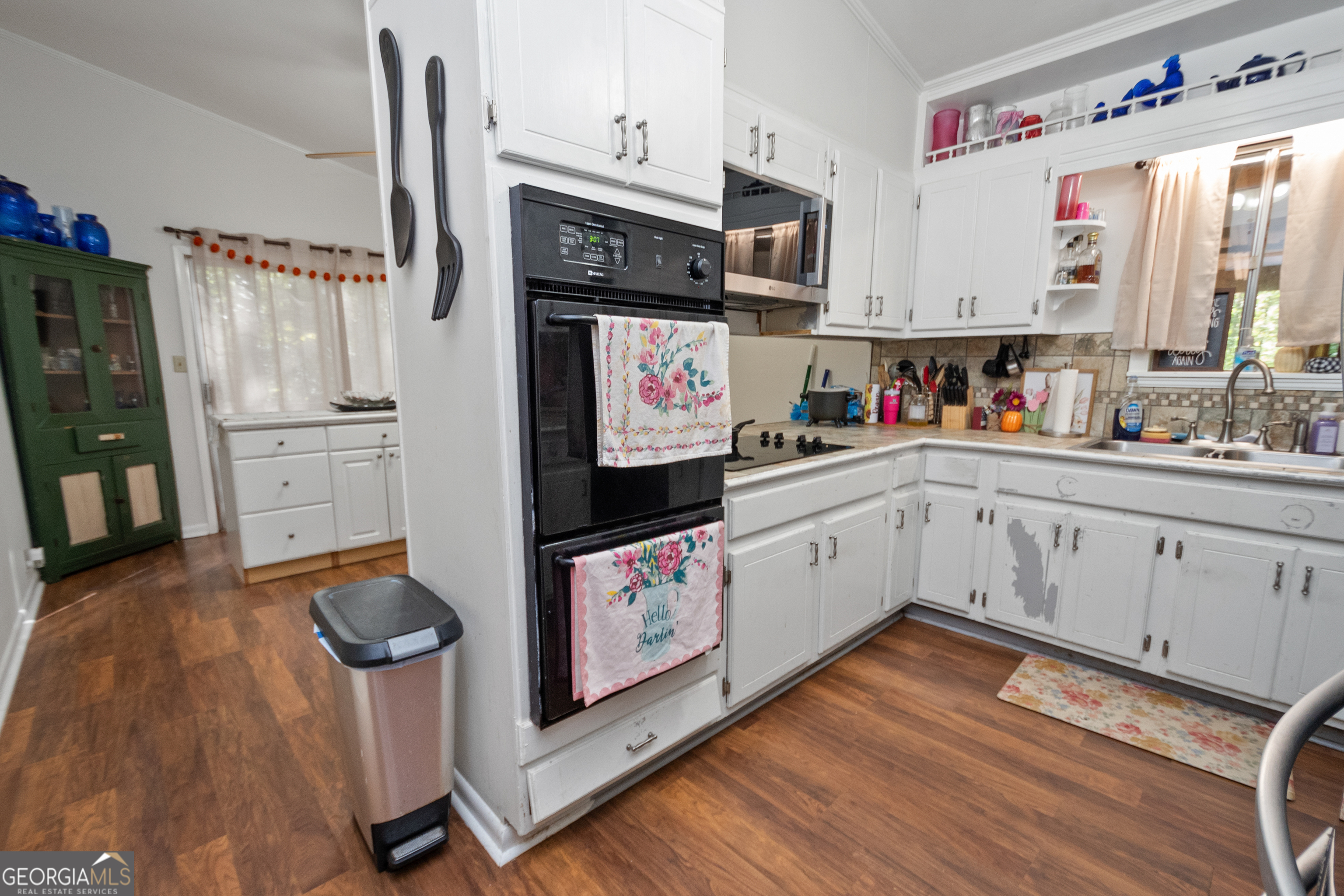 808 South Fling Road LaGrange, GA 30240 - Photo 6 of 35 a kitchen with granite countertop a sink appliances cabinets and wooden floor