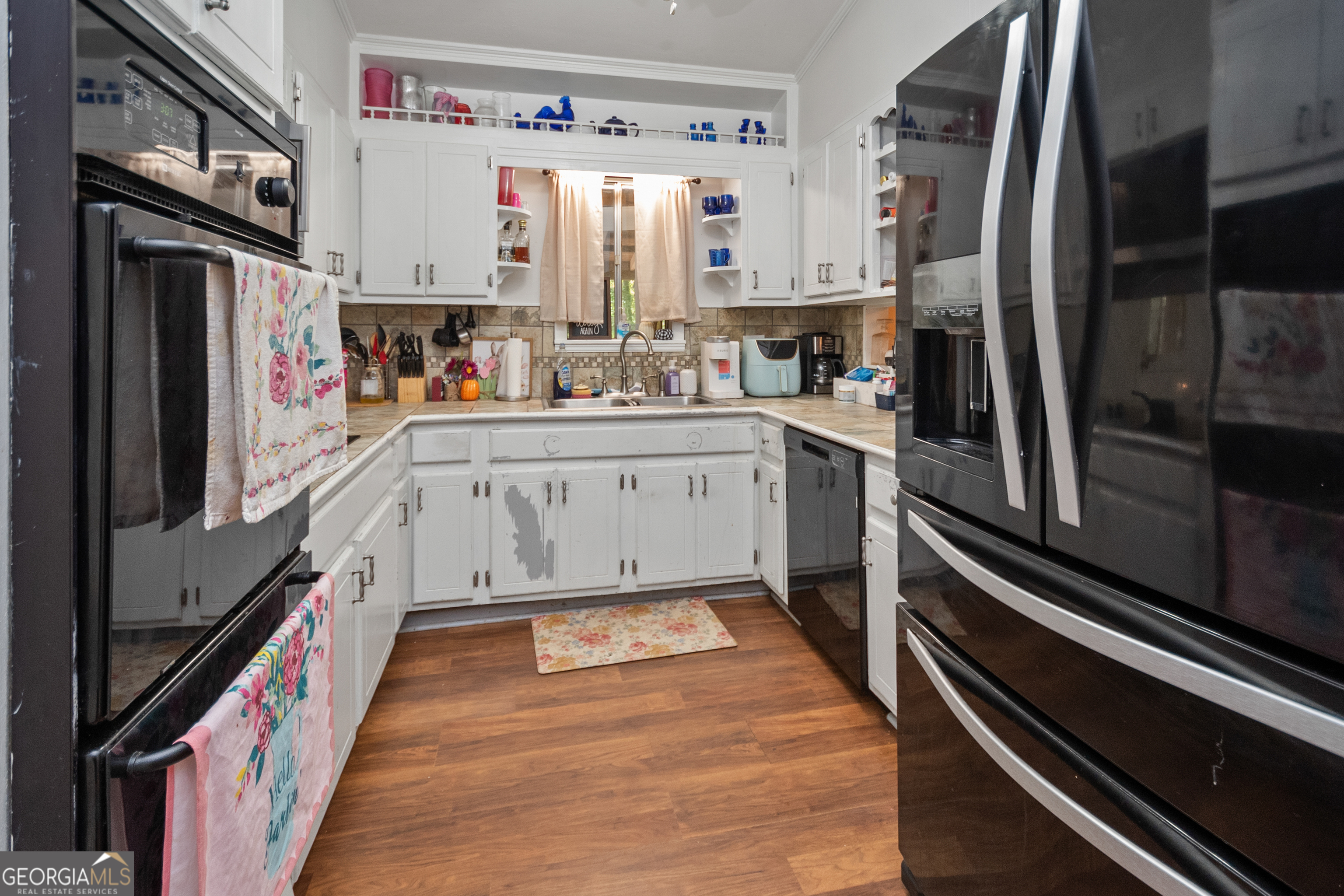 808 South Fling Road LaGrange, GA 30240 - Photo 7 of 35 a kitchen with stainless steel appliances a refrigerator and a stove