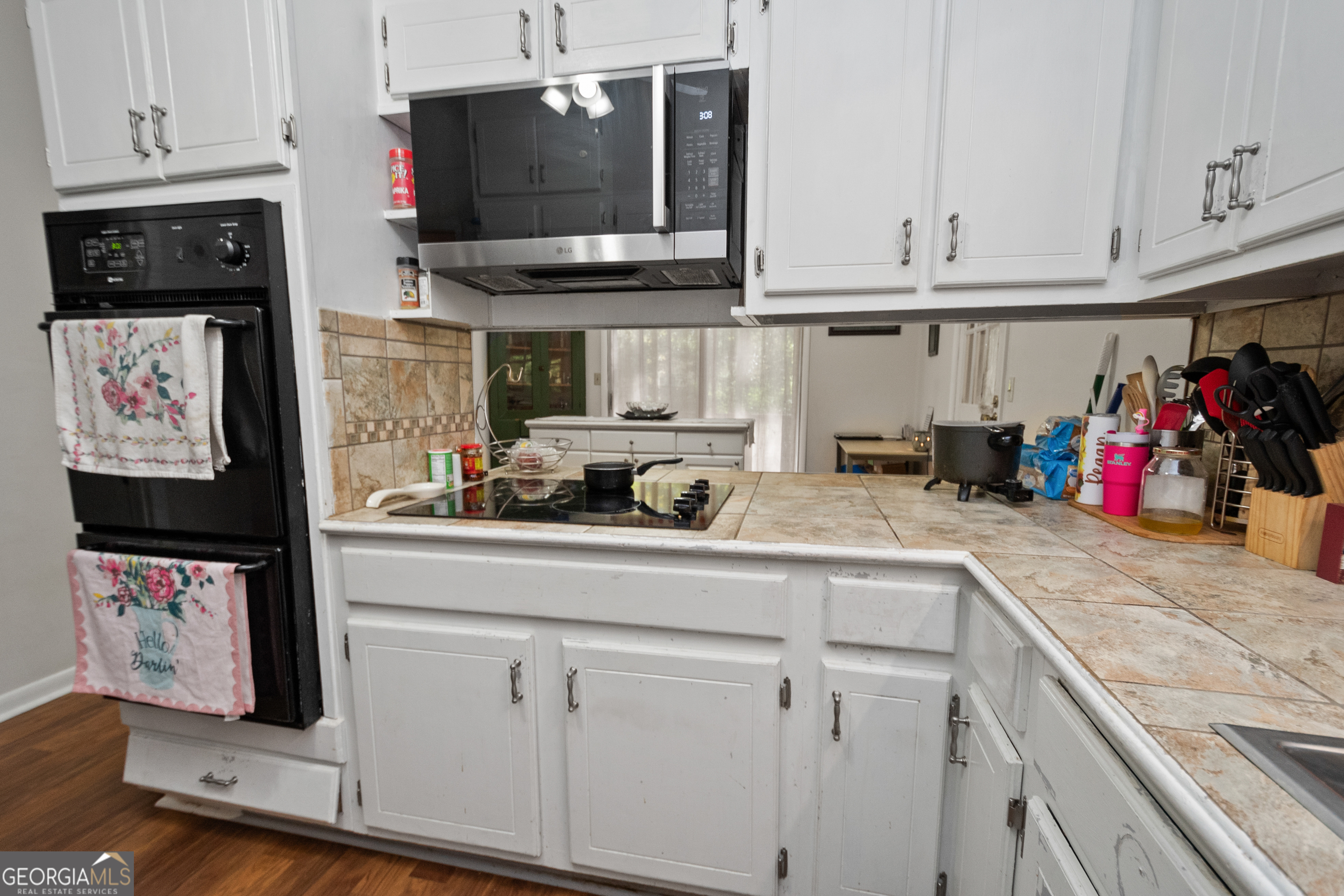 808 South Fling Road LaGrange, GA 30240 - Photo 9 of 35 a kitchen with stainless steel appliances granite countertop a sink and cabinets