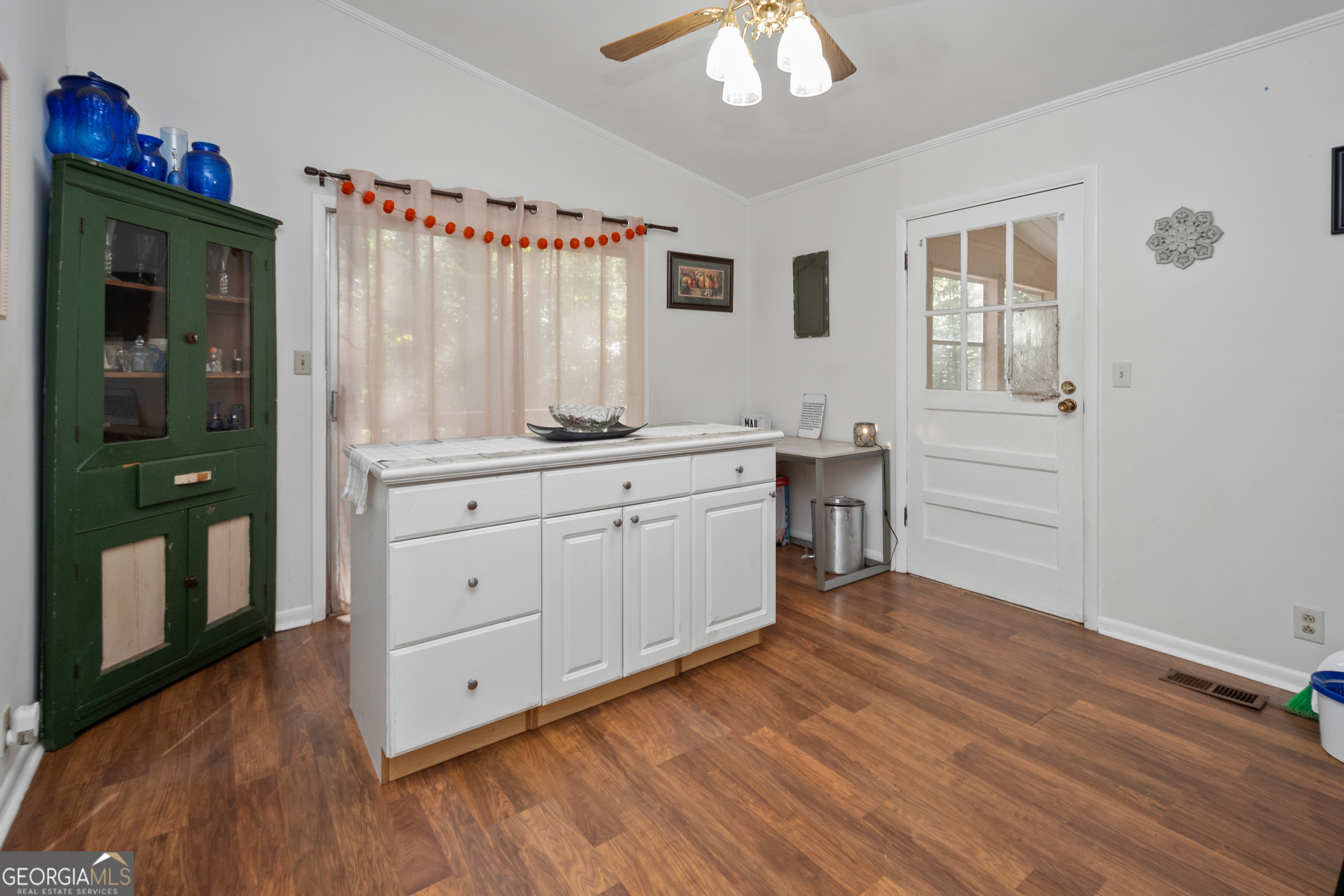 808 South Fling Road LaGrange, GA 30240 - Photo 10 of 35 a view of cabinets with wooden floor and window