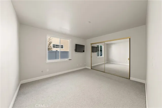 a living room with projector and a flat screen tv