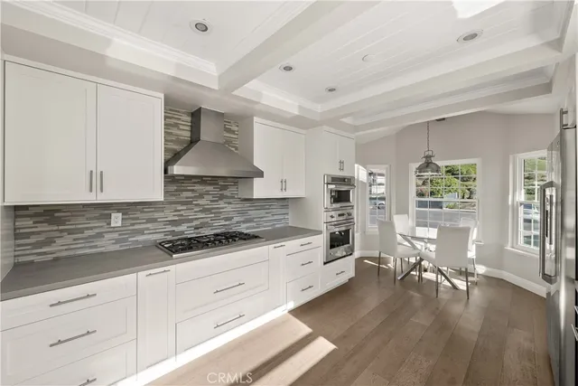 a view of a kitchen and dining room