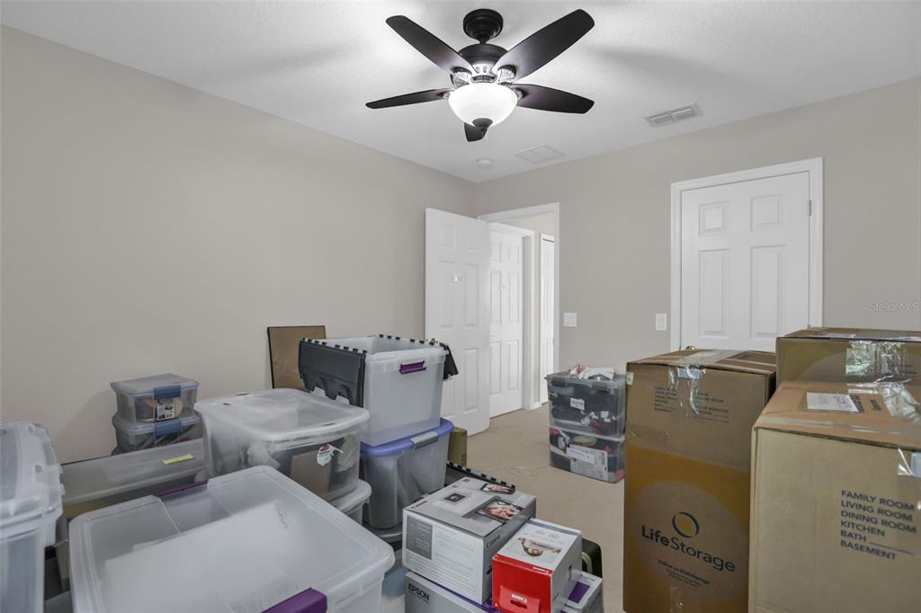 2165 Ridgewood Street Orlando, FL 32803 - Photo 27 of 37 a living room with furniture and a chandelier