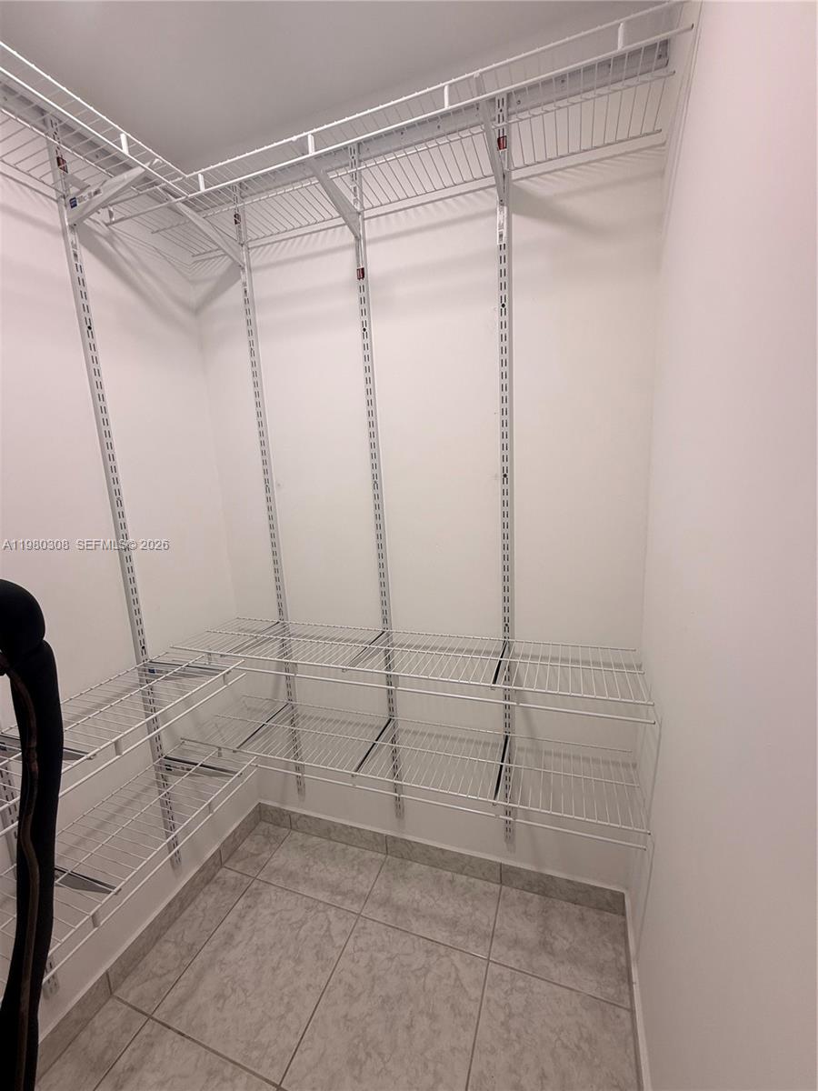 3666 Southwest 24th Terrace, Unit R Miami, FL 33145 - Photo 8 of 10 a view of a room with rack on the wall