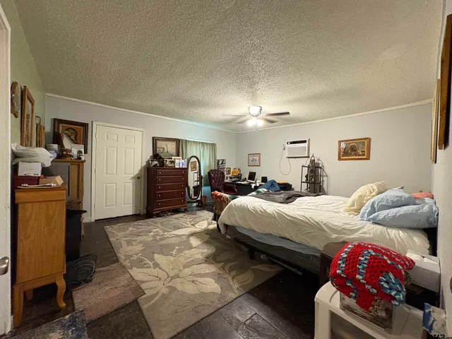 a bedroom with a bed and a walk in closet