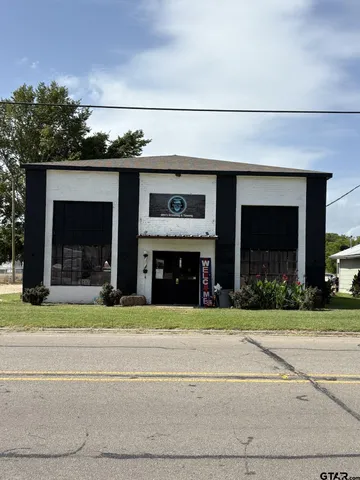 a living room with furniture a window and a fireplace