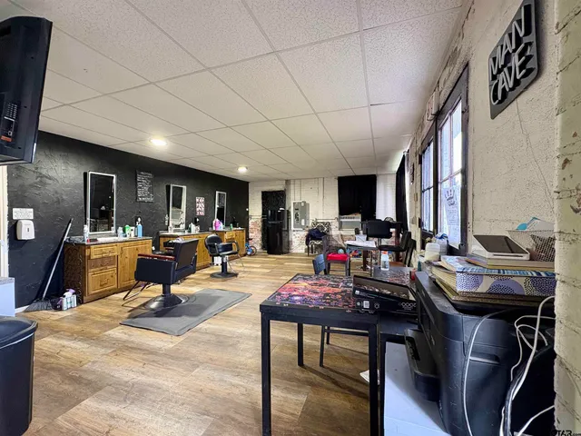 a view of a porch with a table and chairs