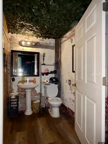 a bed room with a bed and a chair