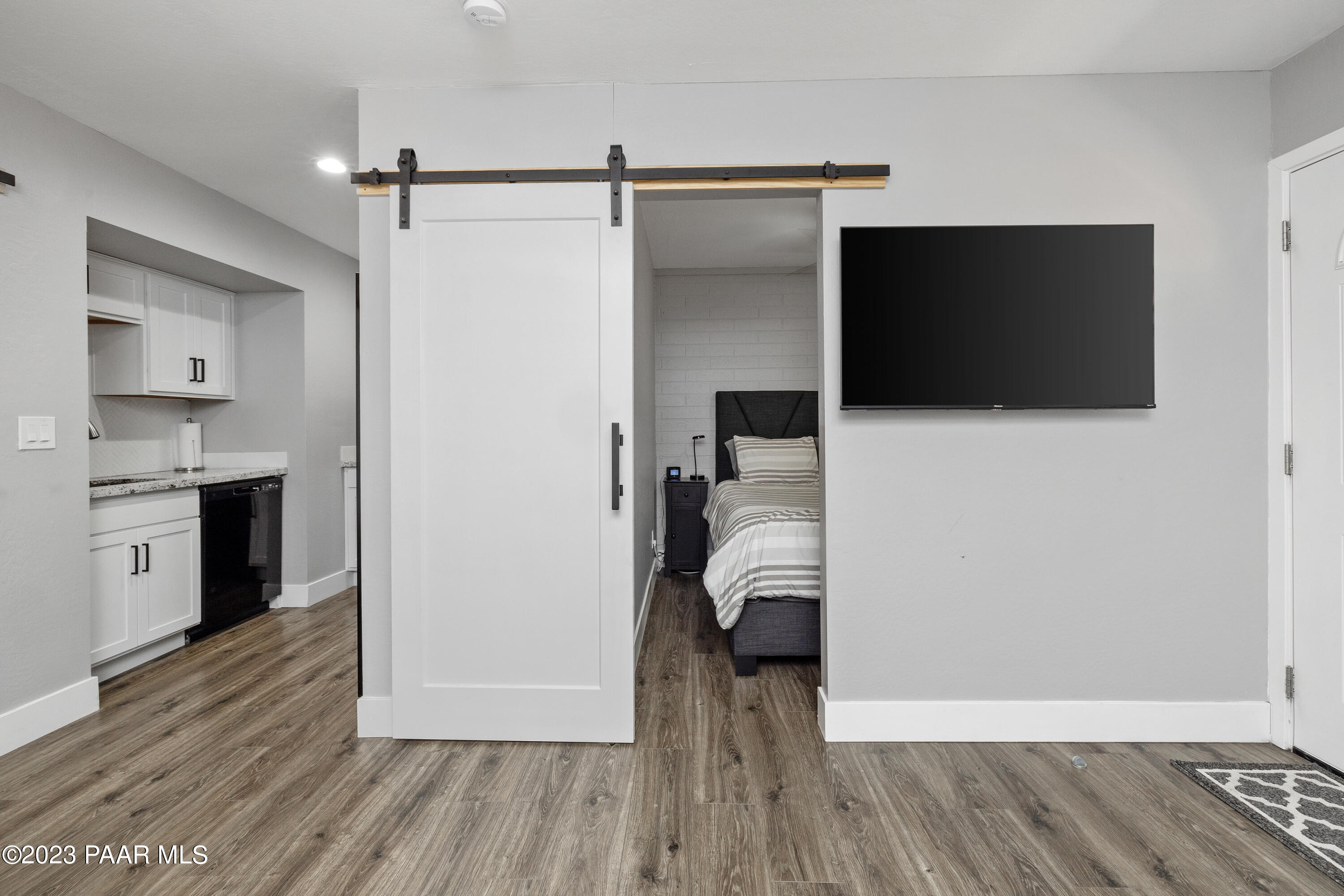 8339 Florentine Road, Unit 2 Prescott Valley, AZ 86314 - Photo 17 of 21 KITCHEN & SLEEPING AREA FROM LIVING ROOM