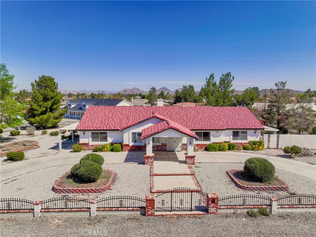 19920 Sahale Road Apple Valley, CA 92307 - Photo 1 of 1 a view of house with swimming pool and outdoor seating