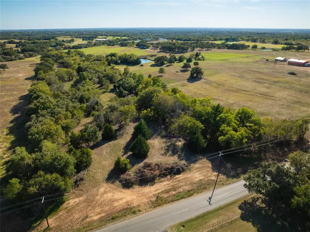 a view of a lake with a yard