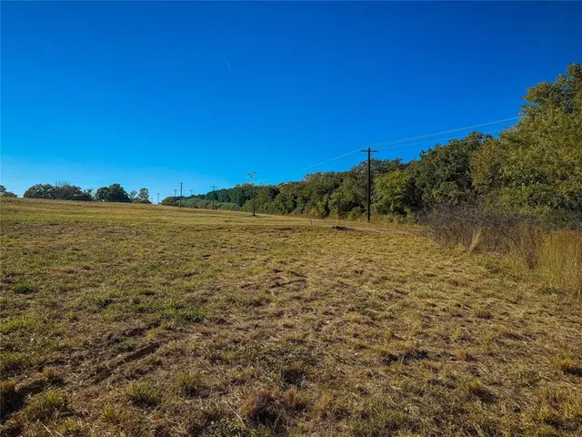 a view of an ocean with a building in the background