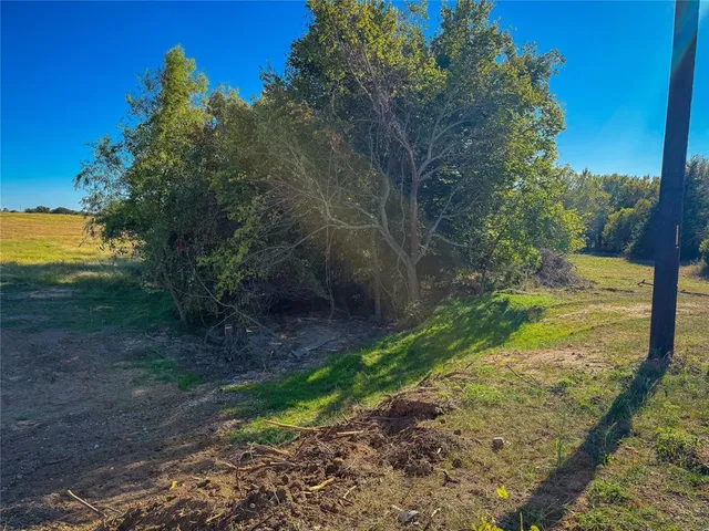 a view of a yard with an ocean view