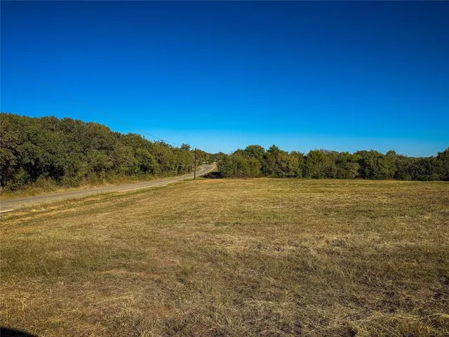 a view of an ocean and a mountain