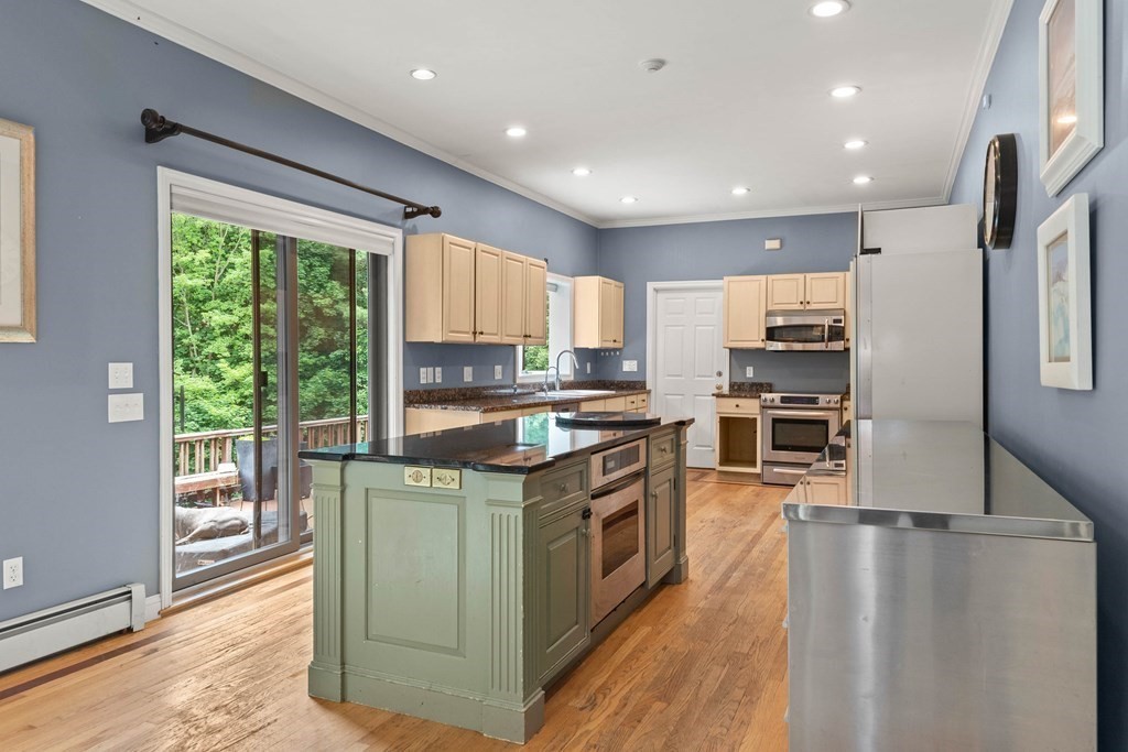 157 Spofford Road Boxford, MA 01921 - Photo 12 of 42 a kitchen with stainless steel appliances granite countertop a stove a sink and a refrigerator