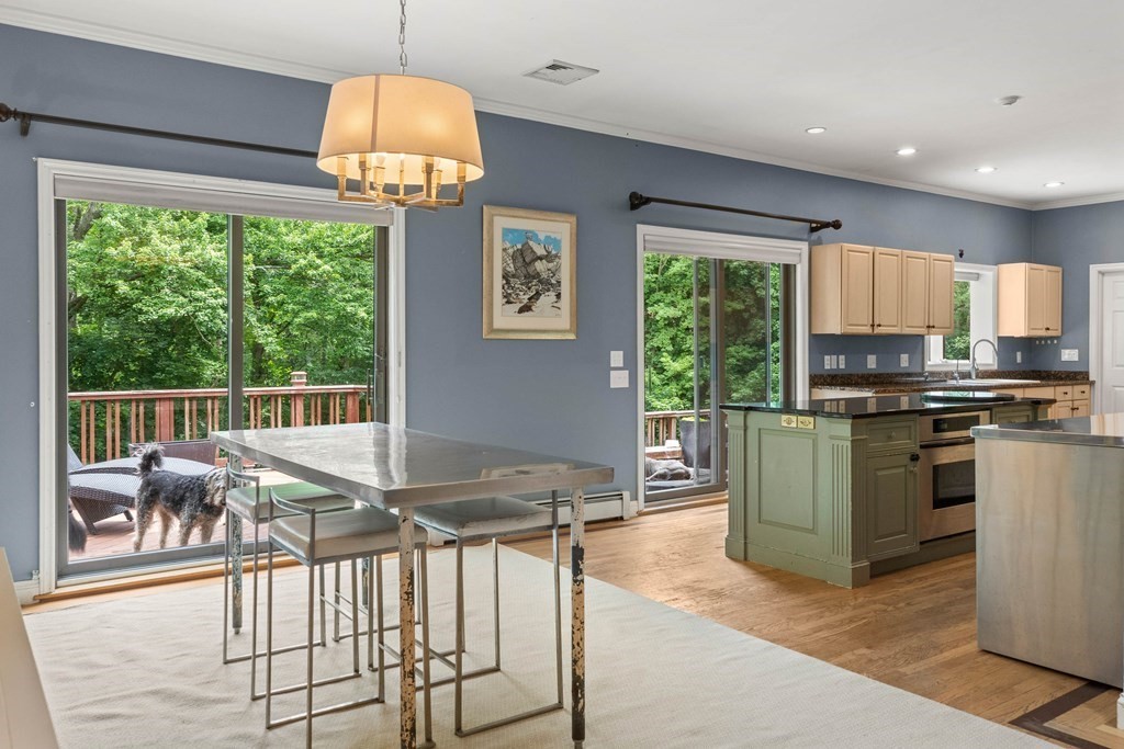 157 Spofford Road Boxford, MA 01921 - Photo 13 of 42 a kitchen with stainless steel appliances granite countertop a stove and a refrigerator