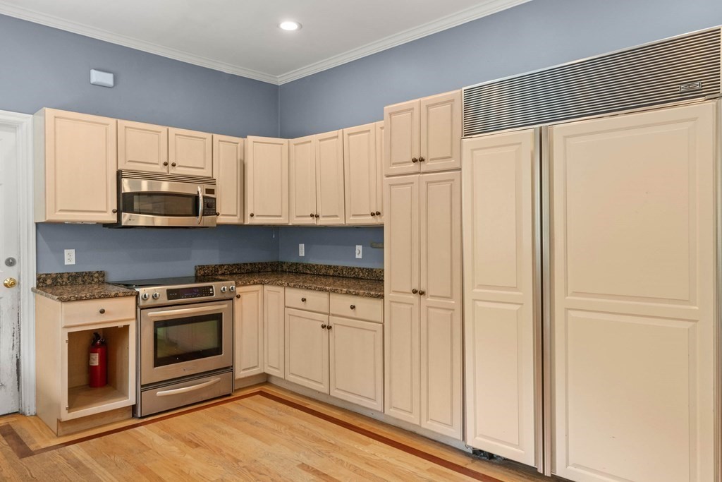 157 Spofford Road Boxford, MA 01921 - Photo 16 of 42 a kitchen with stainless steel appliances white cabinets and a stove top oven