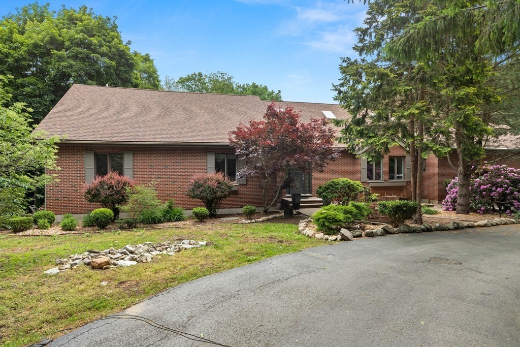 157 Spofford Road Boxford, MA 01921 - Photo 2 of 42 a front view of a house with a yard and outdoor seating
