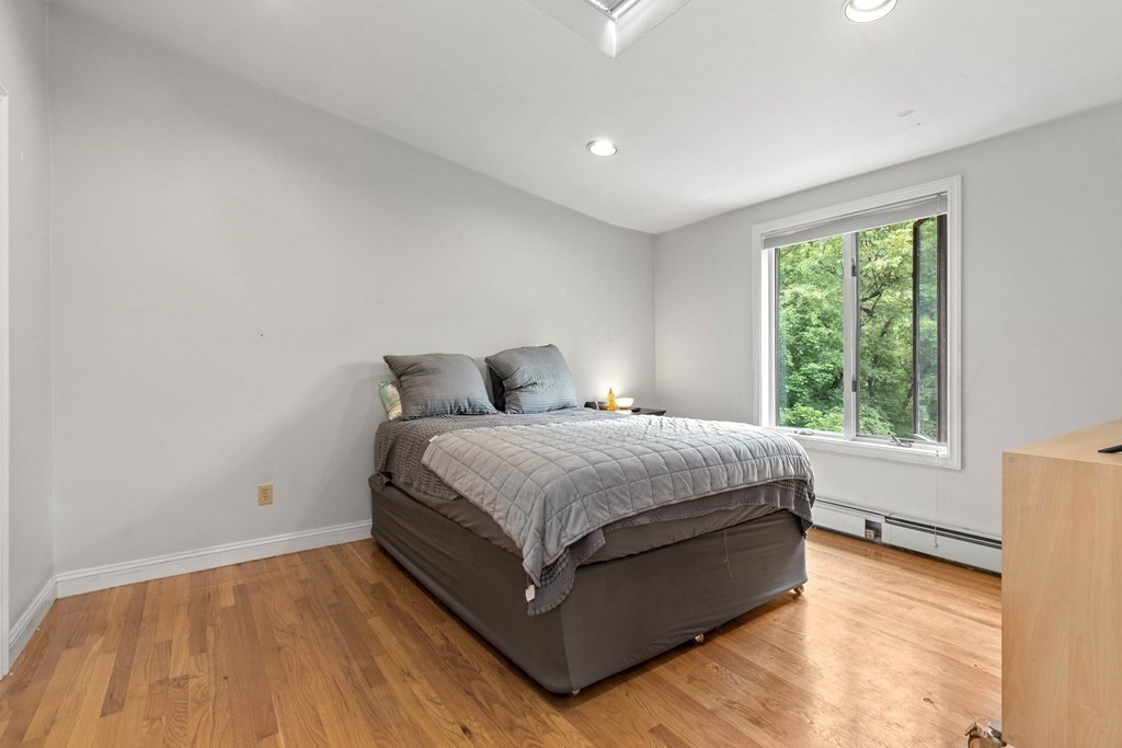 157 Spofford Road Boxford, MA 01921 - Photo 28 of 42 a spacious bedroom with a bed and window
