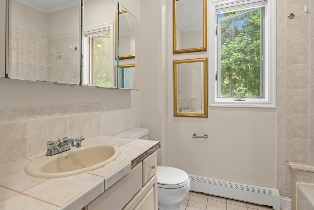 157 Spofford Road Boxford, MA 01921 - Photo 30 of 42 a bathroom with a sink toilet and a mirror
