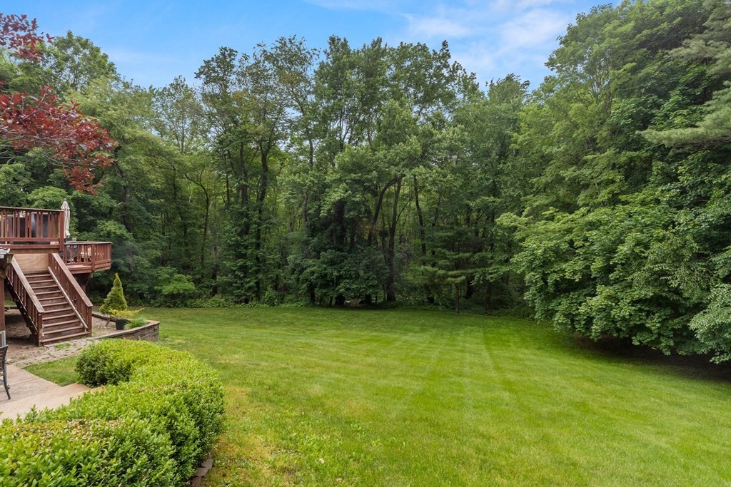 157 Spofford Road Boxford, MA 01921 - Photo 39 of 42 a view of a garden with a bench