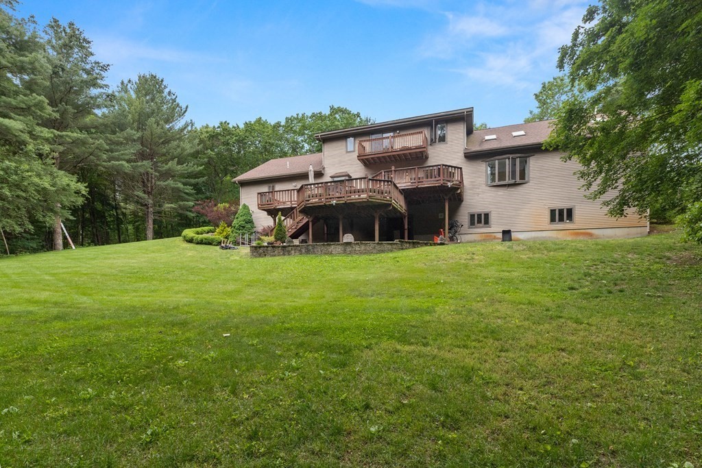 157 Spofford Road Boxford, MA 01921 - Photo 40 of 42 a view of a house with a big yard and large trees
