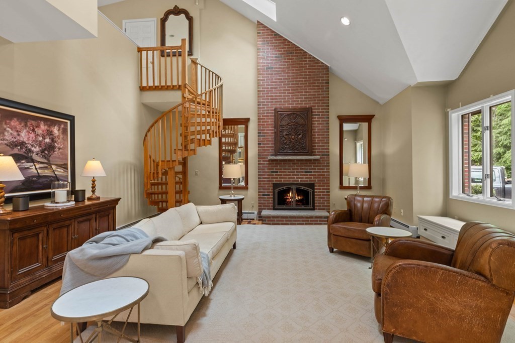 157 Spofford Road Boxford, MA 01921 - Photo 4 of 42 a living room with furniture a fireplace and a flat screen tv