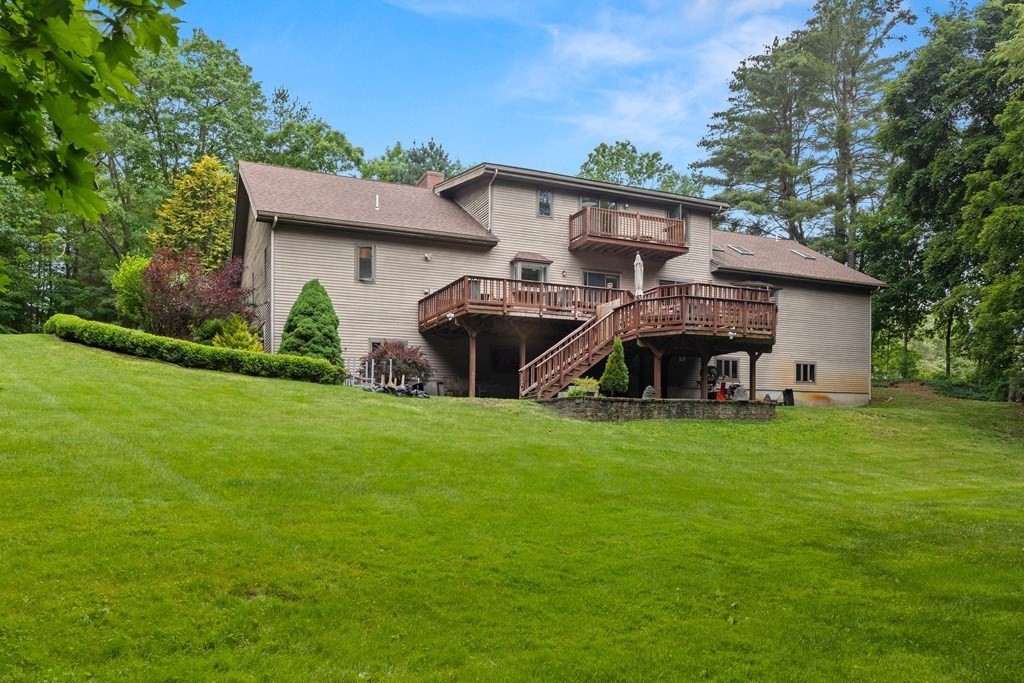 157 Spofford Road Boxford, MA 01921 - Photo 41 of 42 a view of a house with a backyard