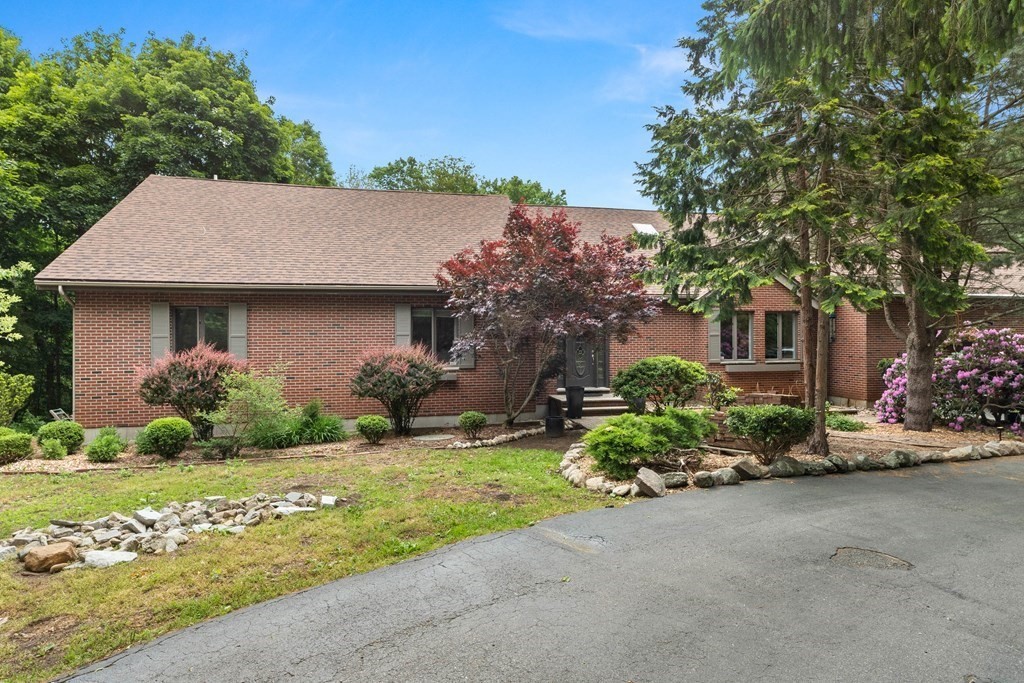 157 Spofford Road Boxford, MA 01921 - Photo 42 of 42 a front view of a house with garden