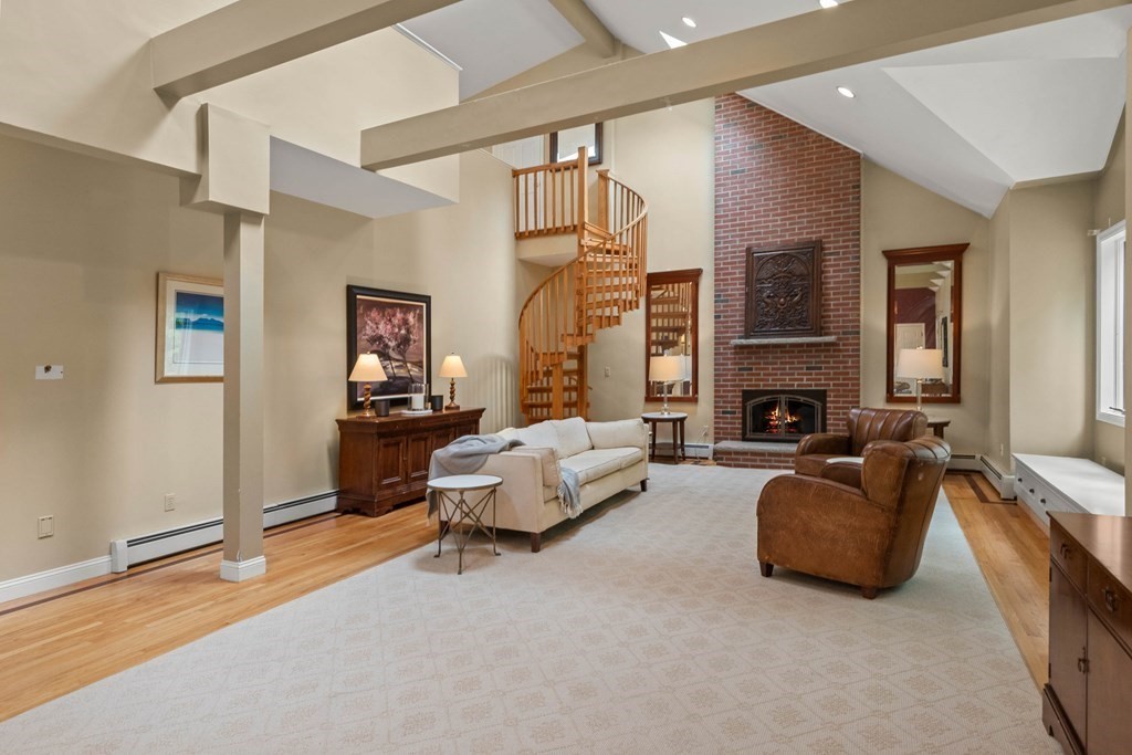 157 Spofford Road Boxford, MA 01921 - Photo 5 of 42 a living room with furniture and a fireplace