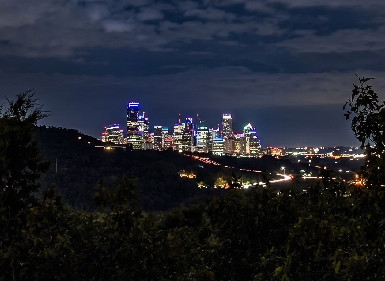 1602 Wild Basin Ledge Austin, TX 78746 - Photo 1 of 5 Cityscape featuring illuminated high-rise buildings and surrounding hills