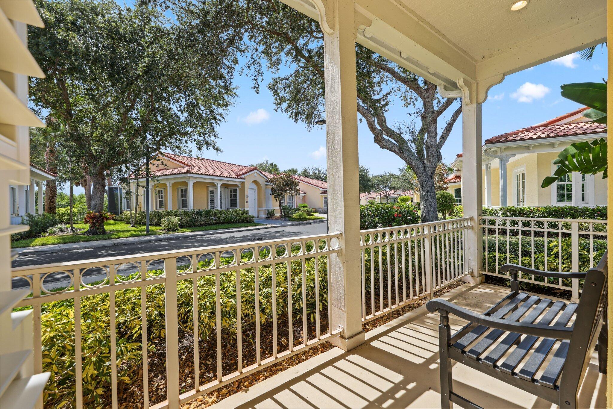 140 Mangrove Bay Way, Unit 140 Jupiter, FL 33477 - Photo 4 of 33 a view of a balcony with wooden floor and fence