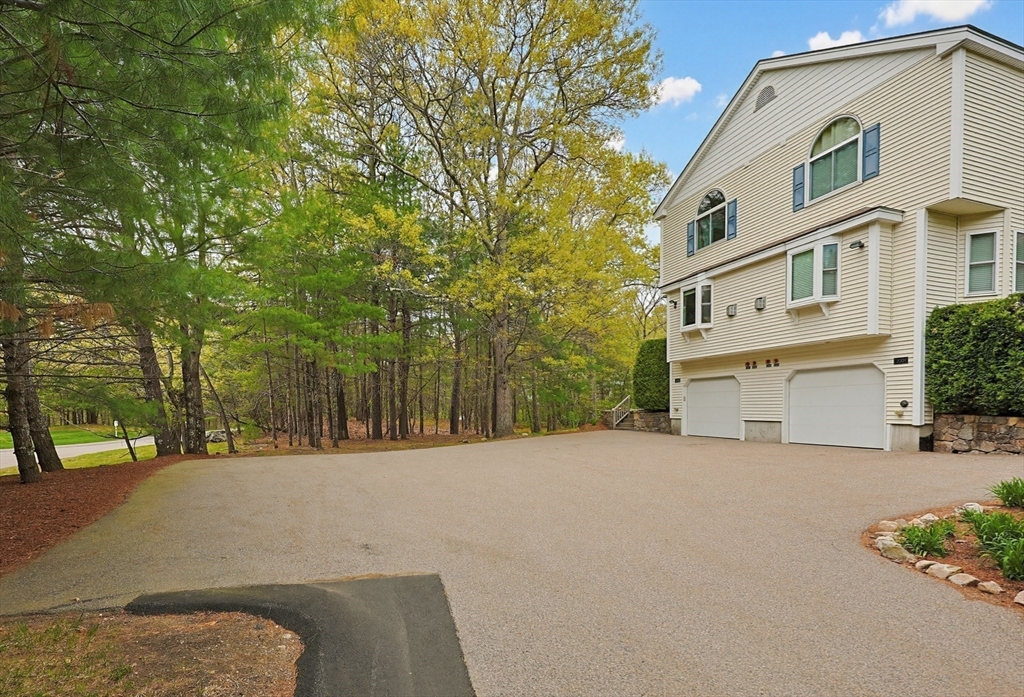 3002 Maple Brook Road, Unit 3002 Bellingham, MA 02019 - Photo 37 of 42 a view of a building with a street