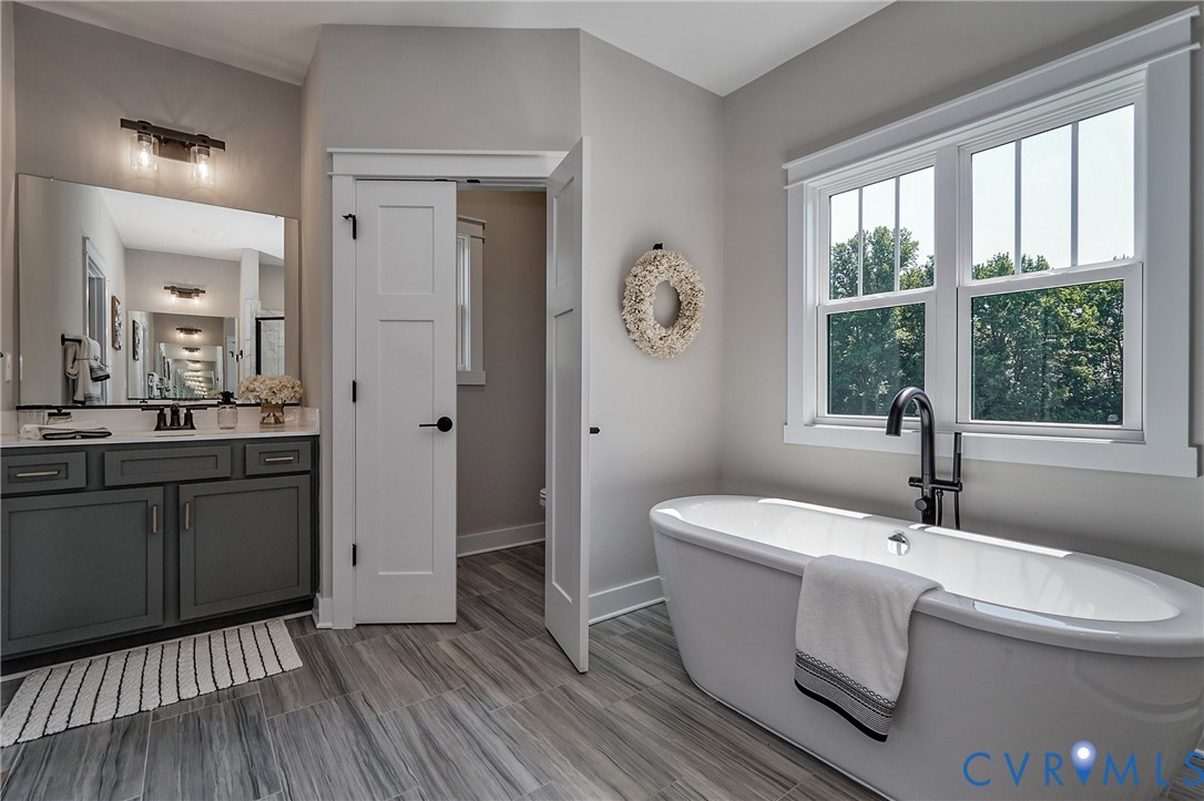 1 Scotchtown Road Beaverdam, VA 23015 - Photo 20 of 29 a bathroom with a sink and a mirror