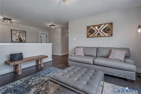 a living room with furniture and a rug
