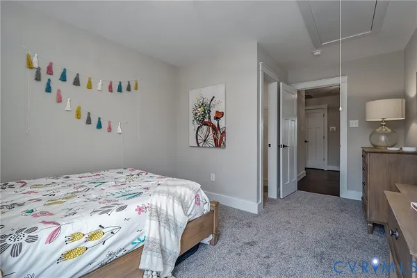 a bedroom with a bed and a view of bathroom