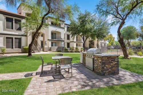 15801 South 48th Street, Unit B1 Phoenix, AZ 85048 - Photo 2 of 6 a view of a house with backyard and a garden