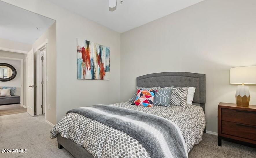 15801 South 48th Street, Unit B1 Phoenix, AZ 85048 - Photo 3 of 6 a bedroom with a bed and painting on the wall