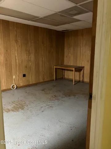 a view of room with table and chairs